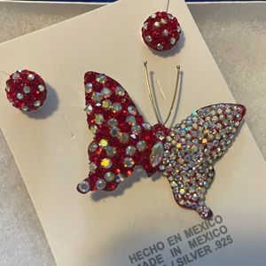 New red butterfly pendant.